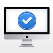 iMac computer with a blue checkmark of approval on the screen