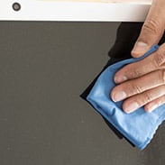 Cleaning a computer screen with a wipe