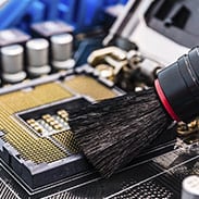 Cleaning a computer interior with a brush