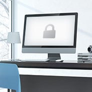 iMac computer with a picture of a secured lock on the screen
